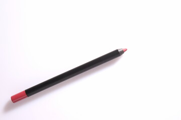 Pink lip liner on white background