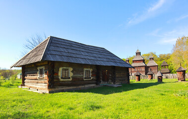 Fototapeta na wymiar Traditional Ukrainian wooden house from Polissya Region in Pirogovo, Ukraine