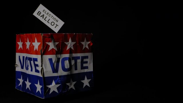 BEAT UP BALLOT BOX WITH GENERIC BALLOT FLOATING ABOVE.  4K.  NO PEOPLE.  NEGATIVE SPACE.