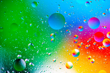 Multicolored abstract background of bubbles and planets in space. Macro photography.