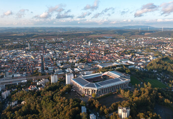 Aerial panoramic skyline cityscape of Kaiserslautern city and Fritz-Walter-Stadion, 1. FC Kaiserslautern stadium at sunset. Rhineland-palatinate, Germany