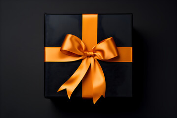 Black gift box with orange bow on black background. Birthday or other holiday greeting card or invitation. Daddy or father day, Black Friday concept