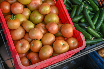 tomatoes in a box on the street near the store 1