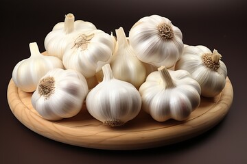 Many heads of garlic on a dark background