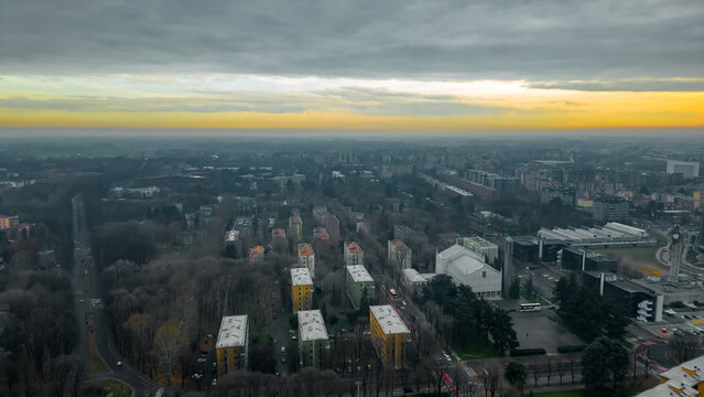 Cityscape top view. Italian city view from a drone Sunset in cloudy weather, view from a drone of the city of San Donato Milanese, Milan, Italy