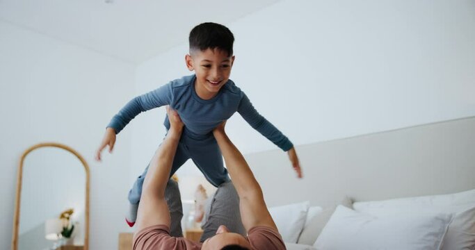 Bedroom, airplane and father with boy, happiness and fun on a weekend break and energy. Family, home and dad with kid or flying with game, love and balance with smile and cheerful or bonding together