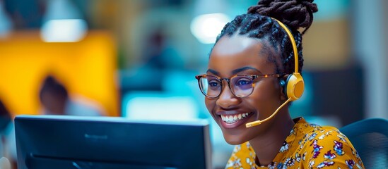 A cheerful black woman operates a call center, providing internet-based customer support and utilizing a computer for CRM telemarketing, all while maintaining a friendly demeanor.