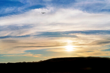 Sunset in the sky, sunrise, over horizon with clouds