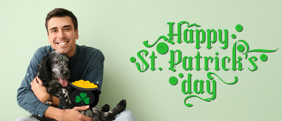 Young man with spaniel dog on green background. Banner for St. Patrick's Day