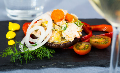 Chicken salad on ring of roasted eggplant served with fresh vegetables