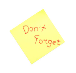 Sticky note with text DON'T FORGET on white background