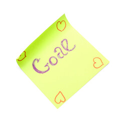 Sticky note with word GOAL and drawn hearts on white background
