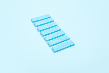 Color chewing gums on blue background