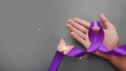 Hands holding purple ribbon. World Cancer Day, lavender purple ribbon to support people living with cancer. 4k animation.