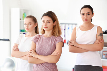 Portrait of young women in gym. Concept of self defense courses - obrazy, fototapety, plakaty
