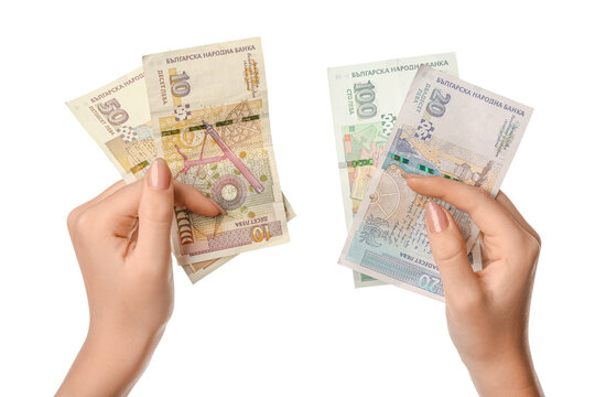 Female hands holding Bulgarian lev banknotes on white background