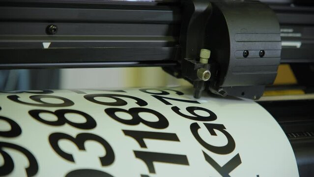 Close up footage of Printing on image on a large technological printer.
