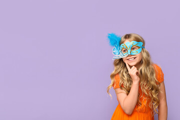 Thoughtful little girl wearing carnival mask on lilac background