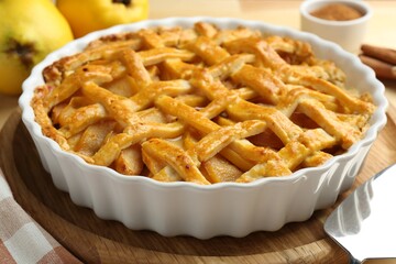Tasty homemade quince pie on table, closeup