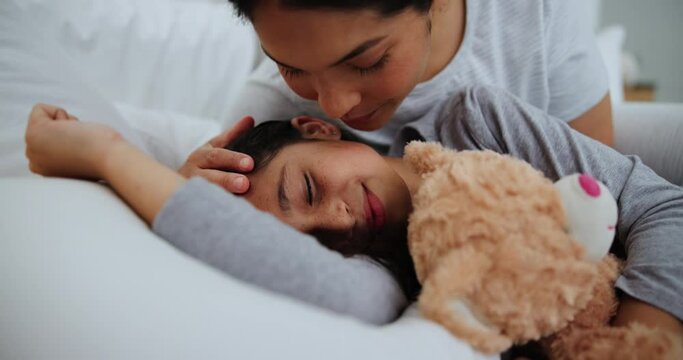 Mom, love and child with teddy bear in bed, sleeping with peace and happiness in home. Mother, kiss and care for girl resting at night with toys in bedroom and family with safety and security
