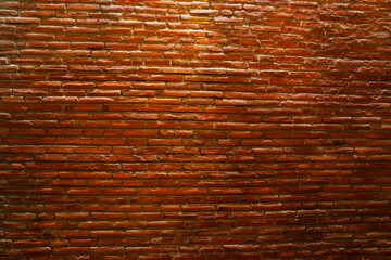 the walls are made of red brick. background