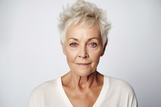 Portrait of senior woman with wrinkles on her face looking at camera