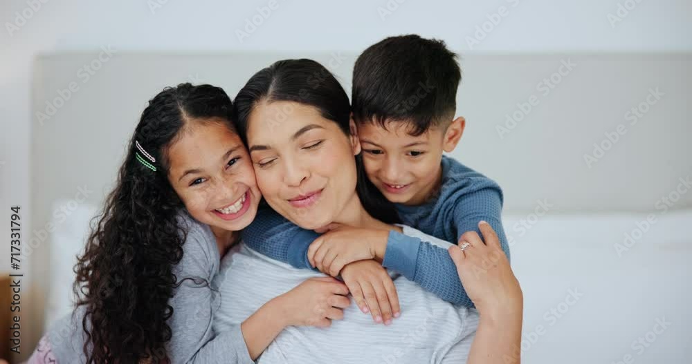 Wall mural Family, love and surprise with children hugging mom in bedroom of home together for playful bonding. Portrait, smile or playing with happy woman parent and excited kids laughing on bed in apartment