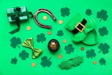 Pot with golden coins, leprechaun hat and horseshoe on green background. St. Patrick's Day...