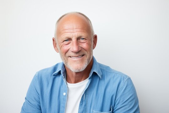 Portrait of a smiling senior man. Isolated on white background.