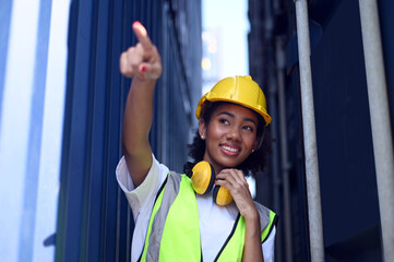 Businesswoman inspecting containers of product before shipping to customers.