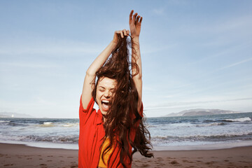 Joyful Woman by the Sea: Smiling, Free, and Radiant in Red Clothes