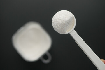  baby milk powder in a plastic spoon 