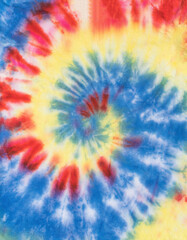 The fabric is painted in a classic tie dye pattern.