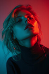 Portrait of a sensual girl with blue and red lights, with the focus on the red lips.