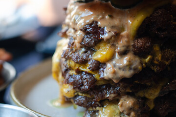 Close up shot of big beef burger full of fresh beef and sauce