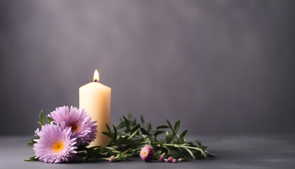 Beautiful purple aster flower and burning candle on dark background.