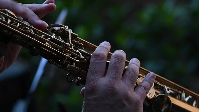 close-up slow motion video of hands playing clarinet