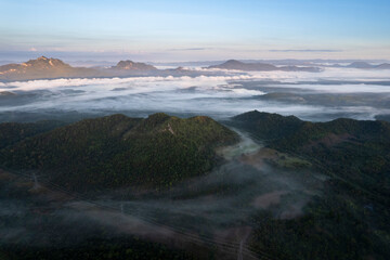 Top view Landscape of Morning Mist with Mountain Layer at north of Thailand. mountain ridge and clouds in rural jungle bush forest