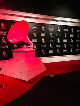 Los Angeles, CA - USA: Sculpture of Grammy Award bathed in red light against Grammy background, Grammy Museum