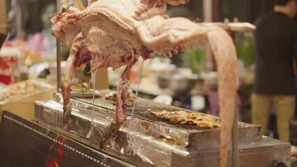 Grilled crocodile vendor at the night food market at Bangkok, Thailand