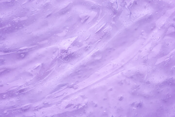 Transparent clear purple liquid serum gel cosmetic texture background