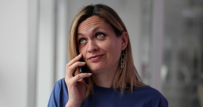 Woman is bored during phone call