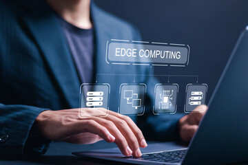 Edge computing concept. Businessman use laptop with virtual screen of edge computing in networking...