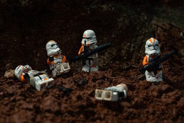 Naklejka premium Depok, Indonesia - January 24, 2024: Lego toys photography, 212th clone troopers on battle over red soil during clone wars, bokeh background