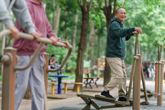 Old people who exercise with exercise equipment in the park