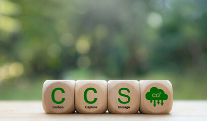 The word Carbon Capture Storage and the abbreviation CCS on a wooden block. Net Zero Action concept. Green energy. Reduce carbon emissions and carbon capture - obrazy, fototapety, plakaty