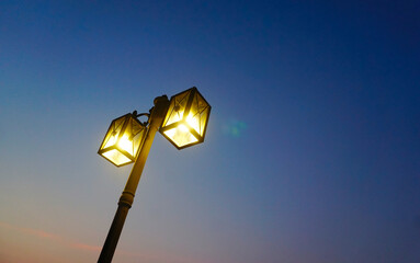Light at lamp post with twilight sky background