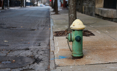 urban scene with a red fire hydrant standing tall on a sunlit street corner, symbolizing safety and preparedness