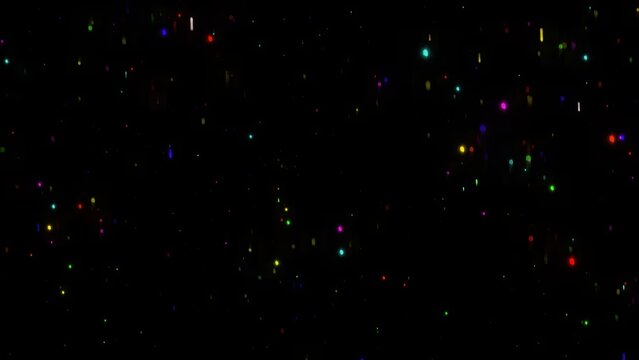 Colorful glitter particles on plain black background