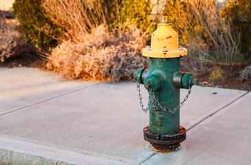 urban scene with a red fire hydrant standing tall on a sunlit street corner, symbolizing safety and preparedness